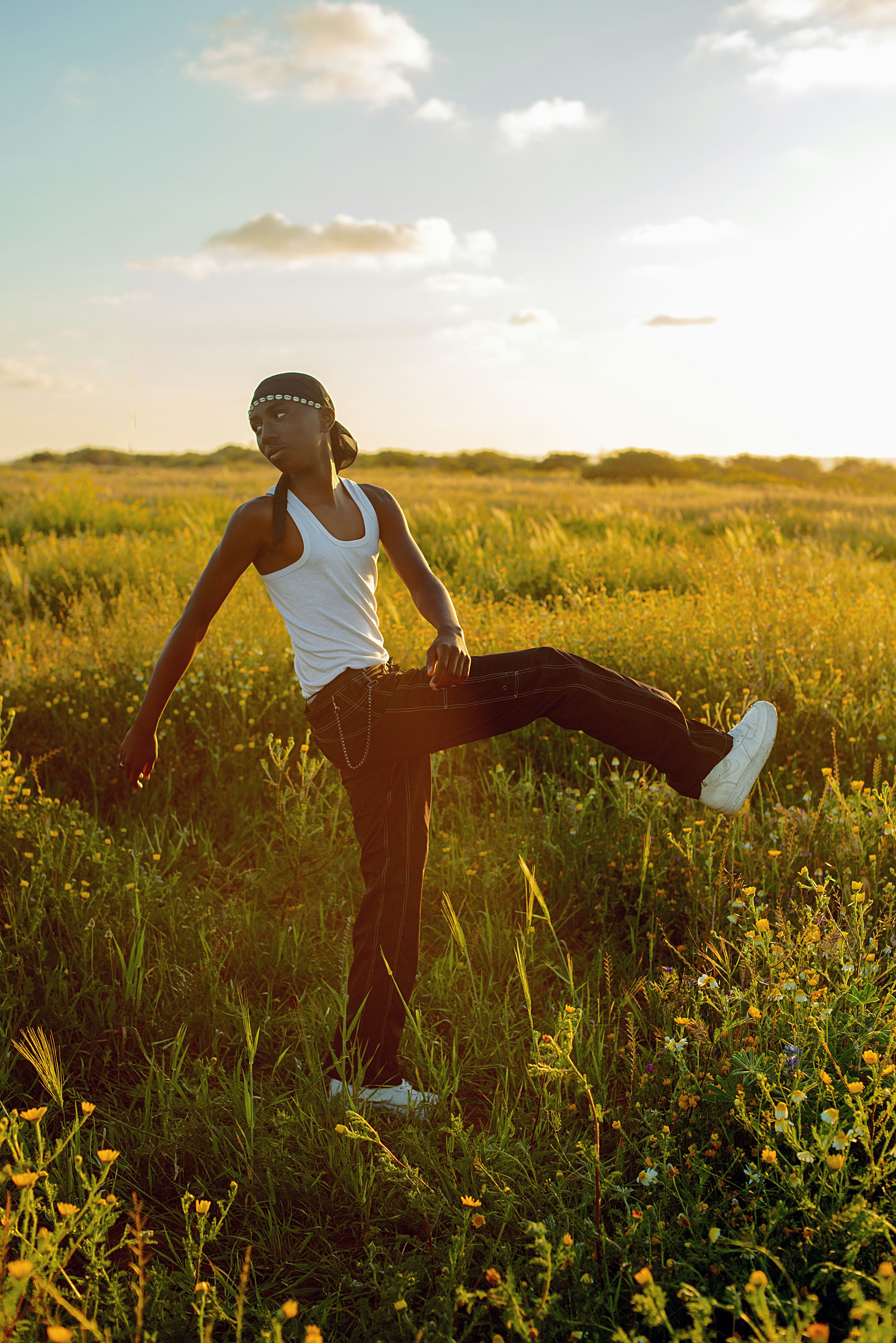 A woman standing in a field of tall grass photo – Free Brown Image on ...