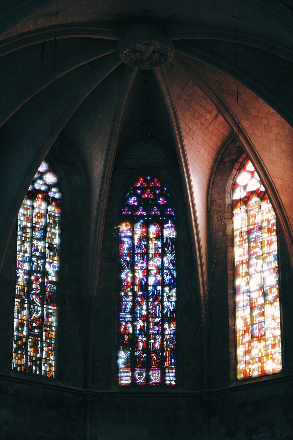 two large stained glass windows in a church