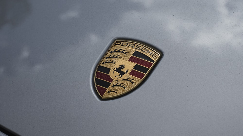 a close up of a porsche emblem on a car