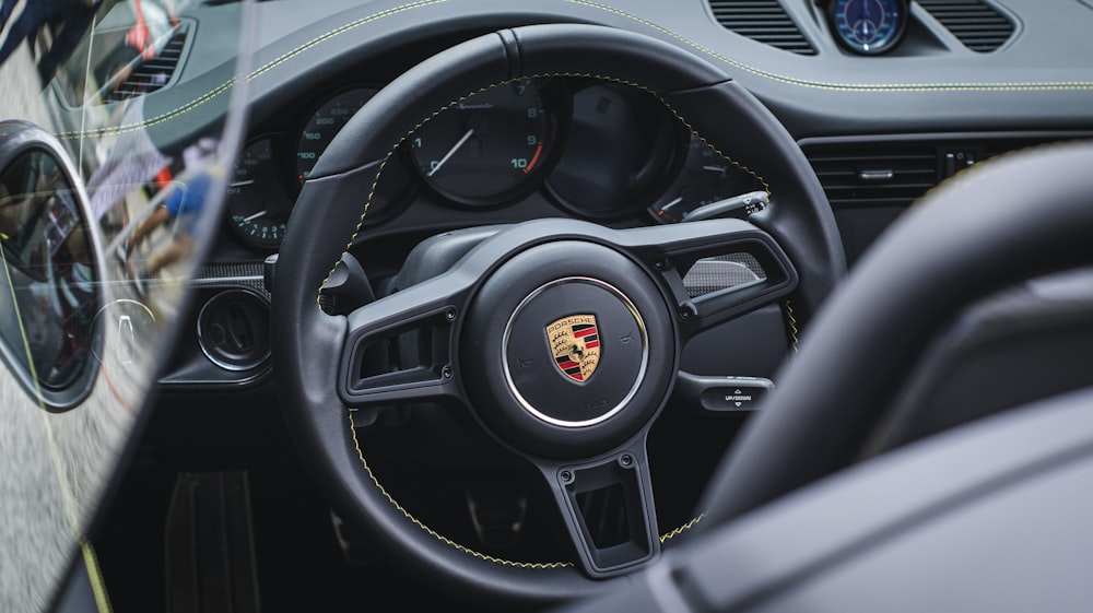 a close up of a steering wheel and dashboard of a car