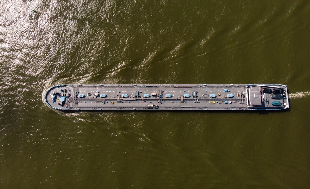 an aerial view of a ship in the water