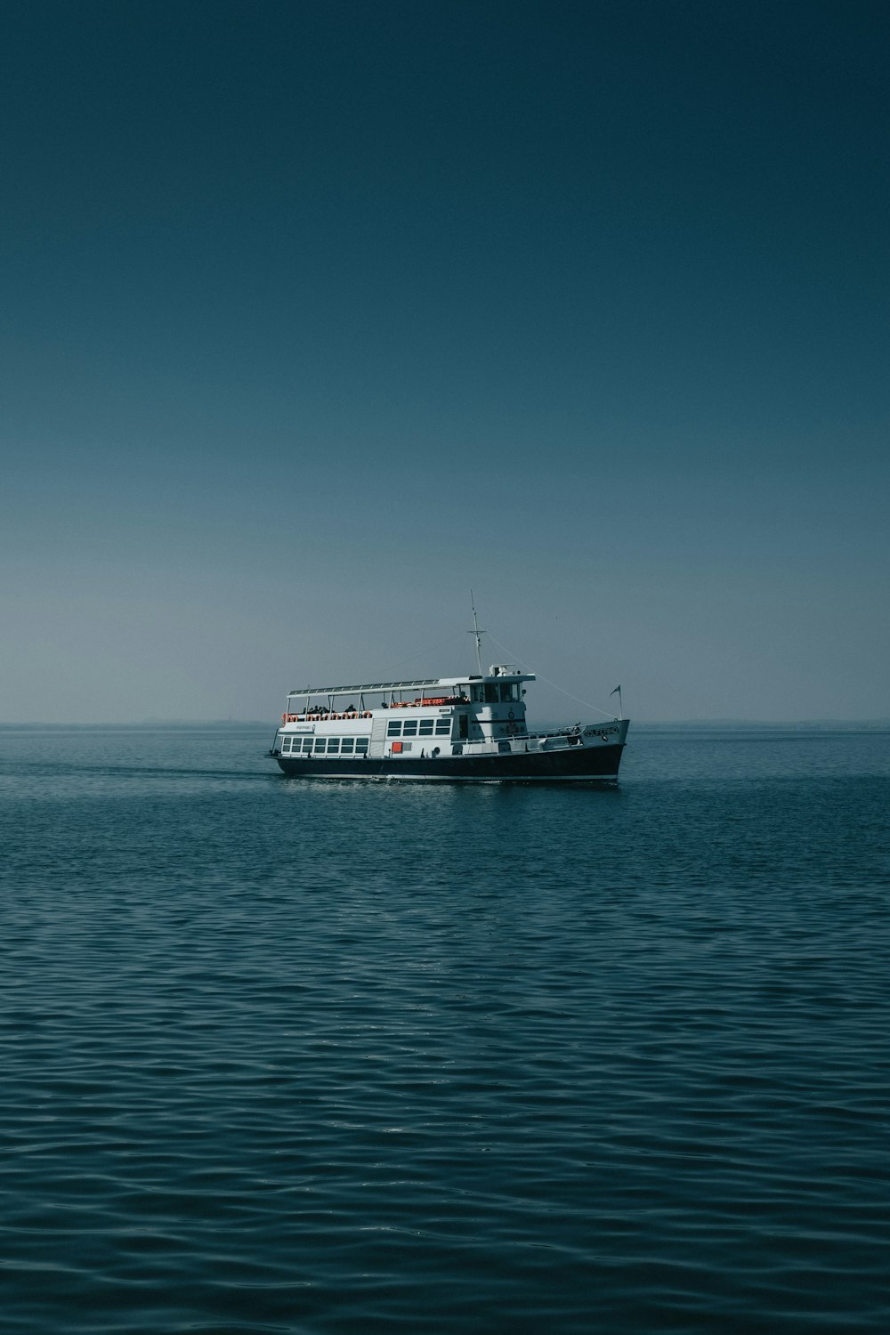 a large boat floating on top of a large body of water