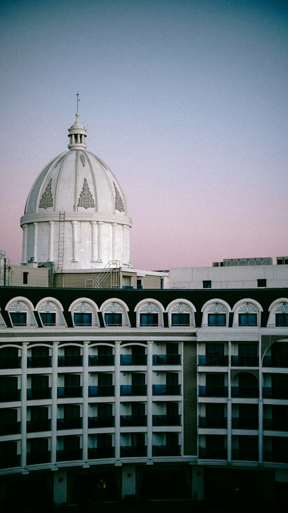 a large white building with a dome on top of it