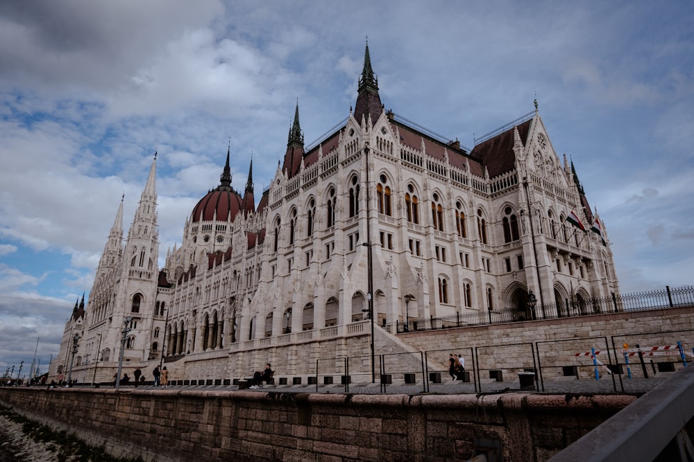 a large white building with many windows and spires