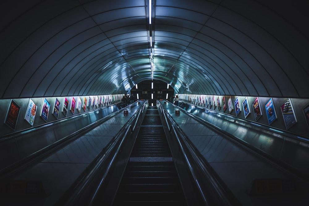 an escalator in a subway station at night