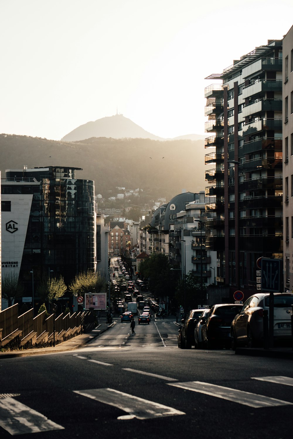 a view of a city street with tall buildings