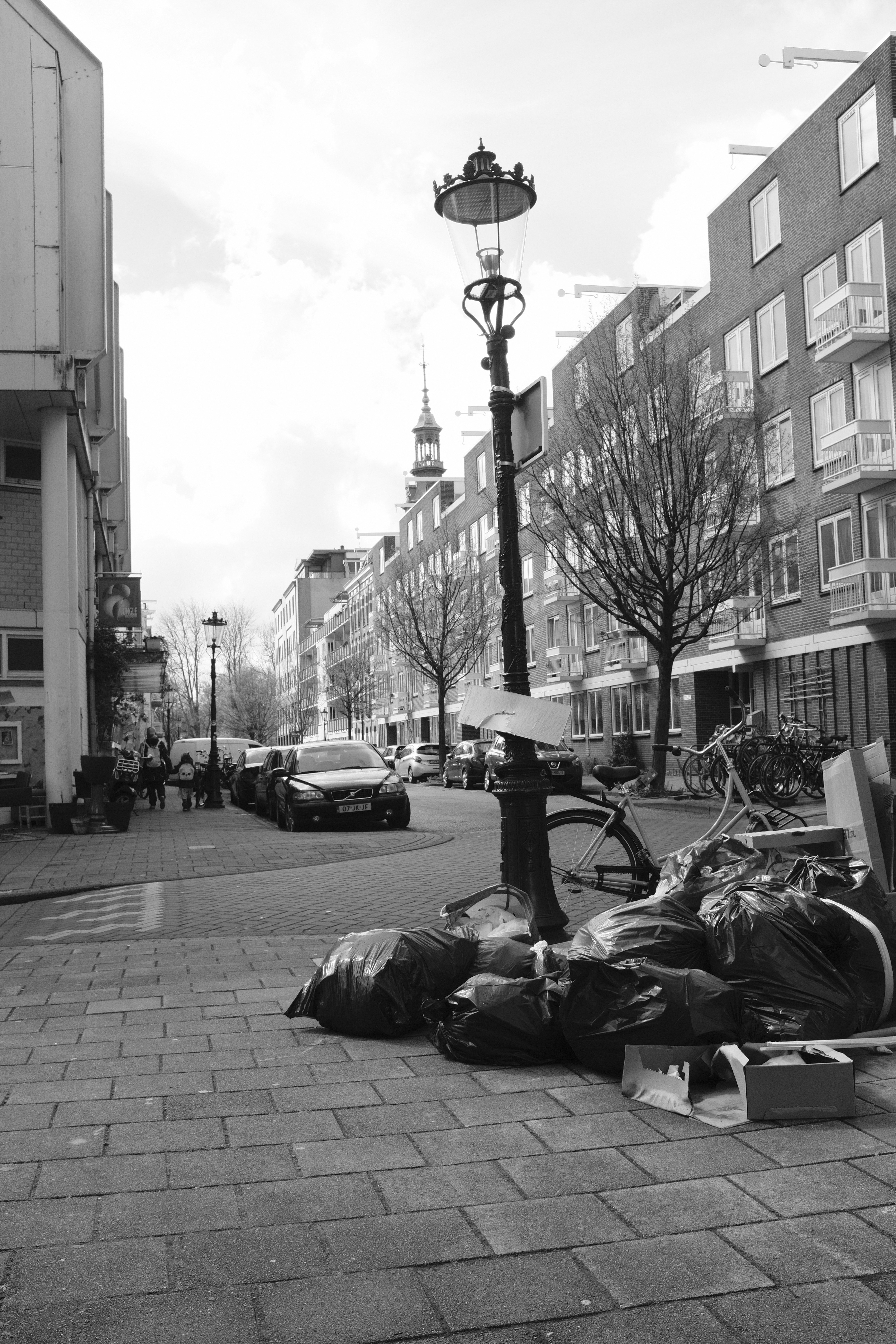 A black and white photo of a city street