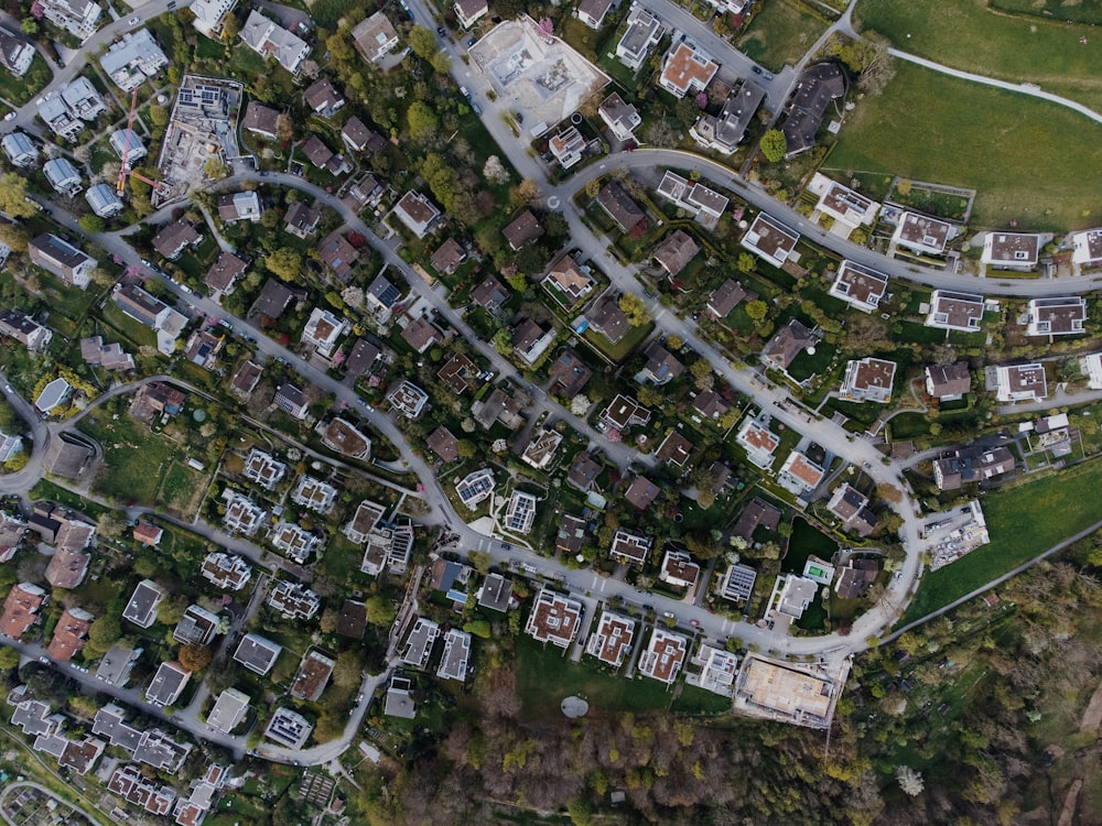 an aerial view of a city with lots of houses