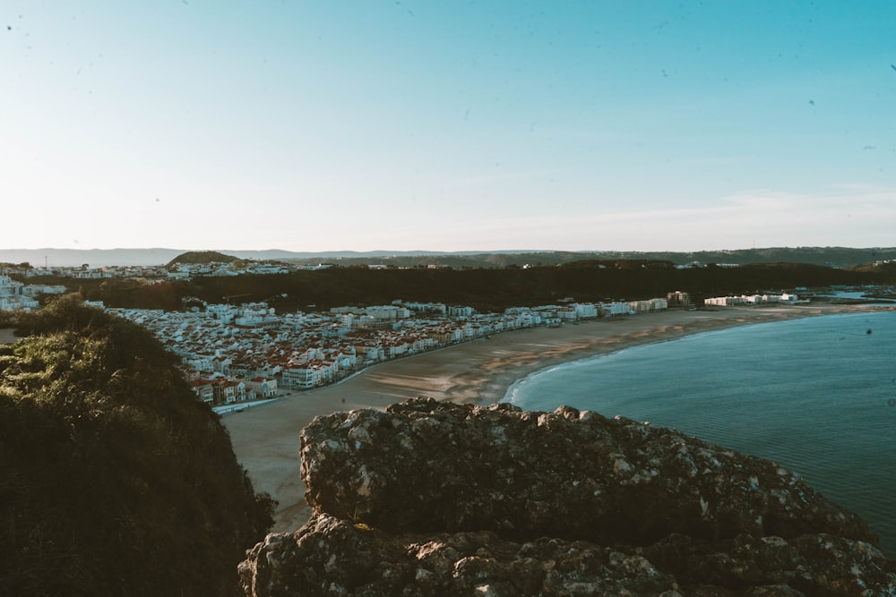 a view of a beach from a cliff