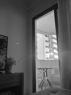 A modern UPVC sliding door opening to a sunny balcony.