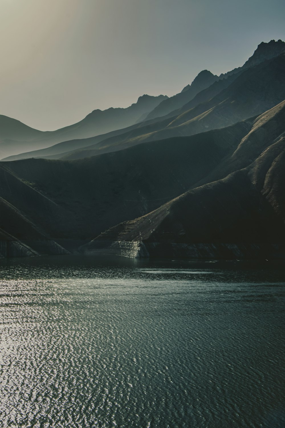 a large body of water surrounded by mountains