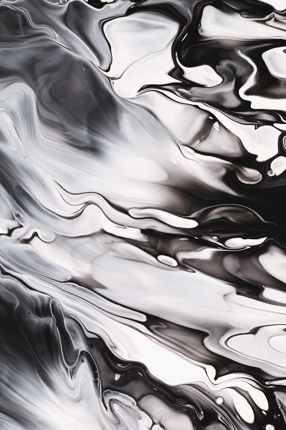 a black and white abstract painting with water