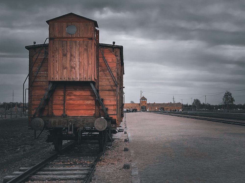 an old train car sitting on the tracks