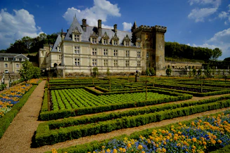 a large building with a garden in front of it
