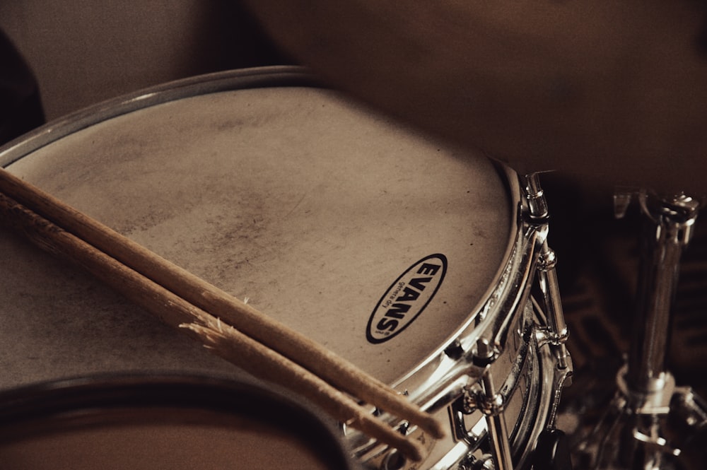 a close up of a drum and sticks
