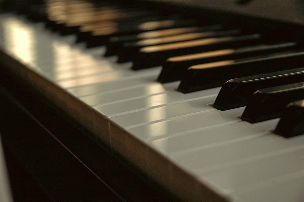 a close up of a piano keyboard with many keys