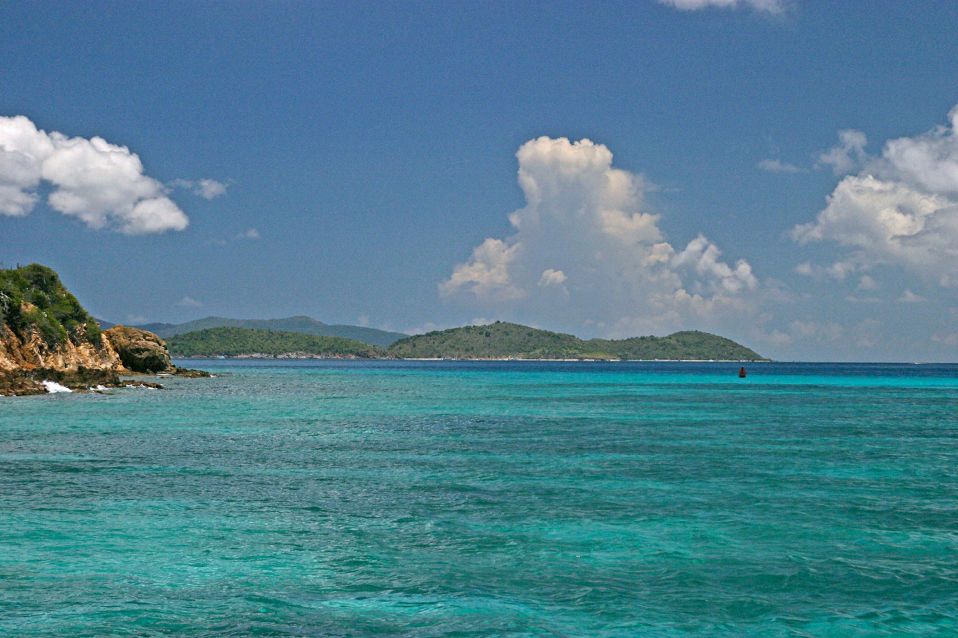 An ocean view of Caribbean islands and cays on the horizon.