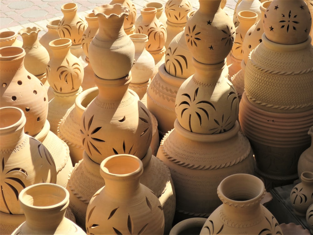 a group of clay pots sitting on top of a table