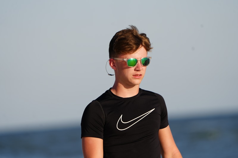 stylish young man in sunglasses and black shirt