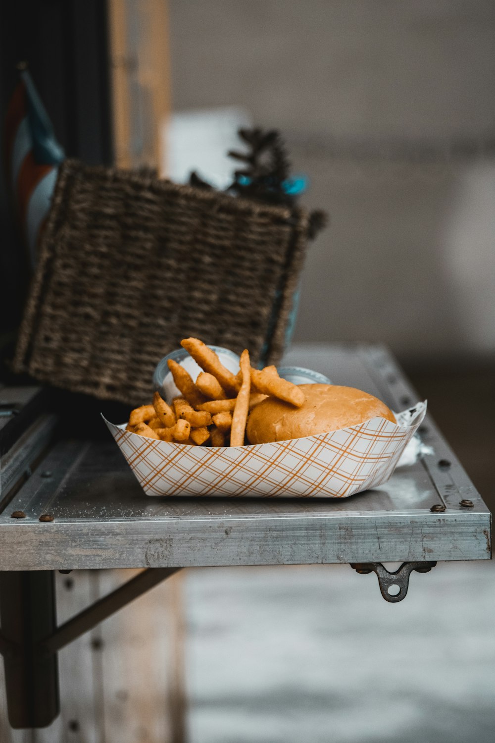 a basket of french fries sitting on top of a table