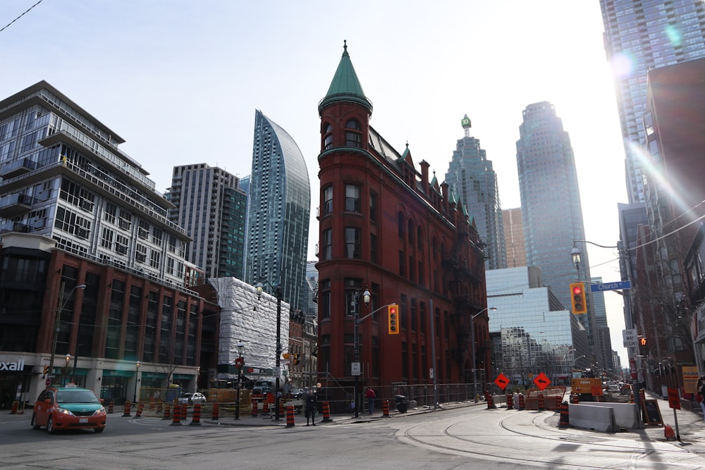 a city street with tall buildings and a traffic light