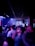 A lively dance floor packed with smiling guests enjoying a vibrant club event.