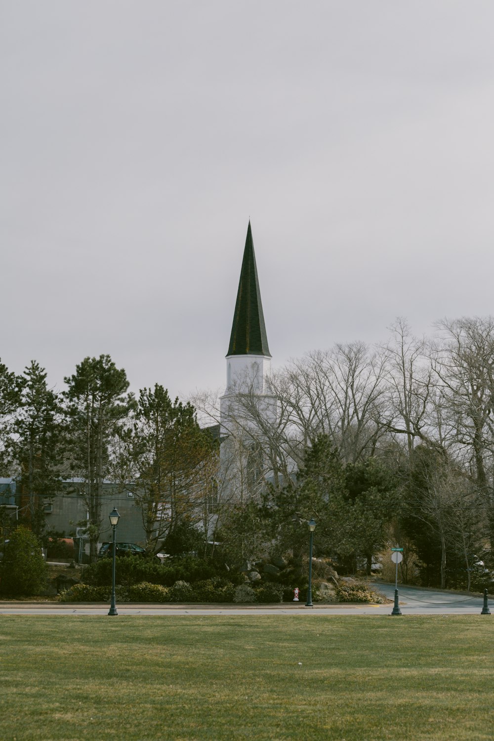 a church steeple with a green steeple on top of it