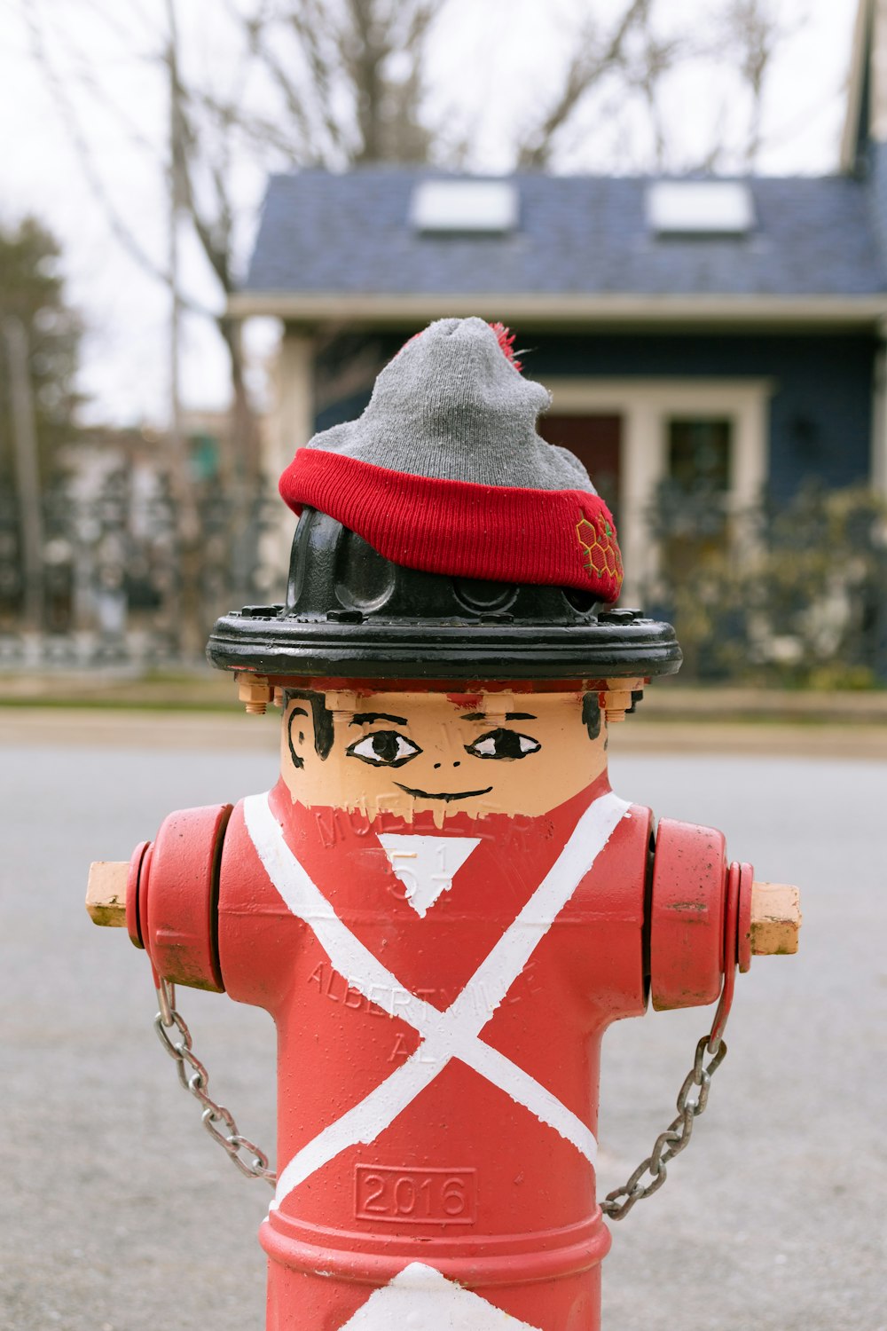 a fire hydrant with a hat on top of it