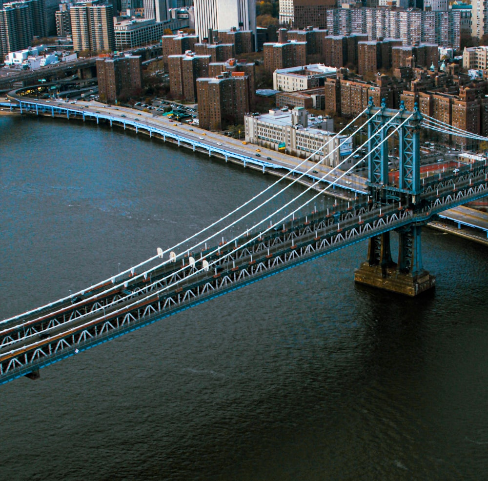 an aerial view of a bridge spanning the width of a city