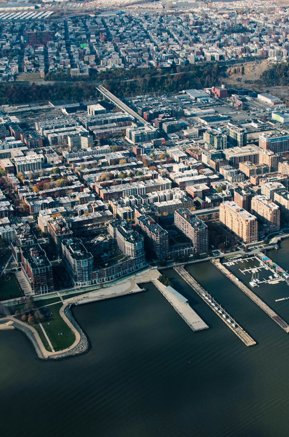 an aerial view of a city and a body of water