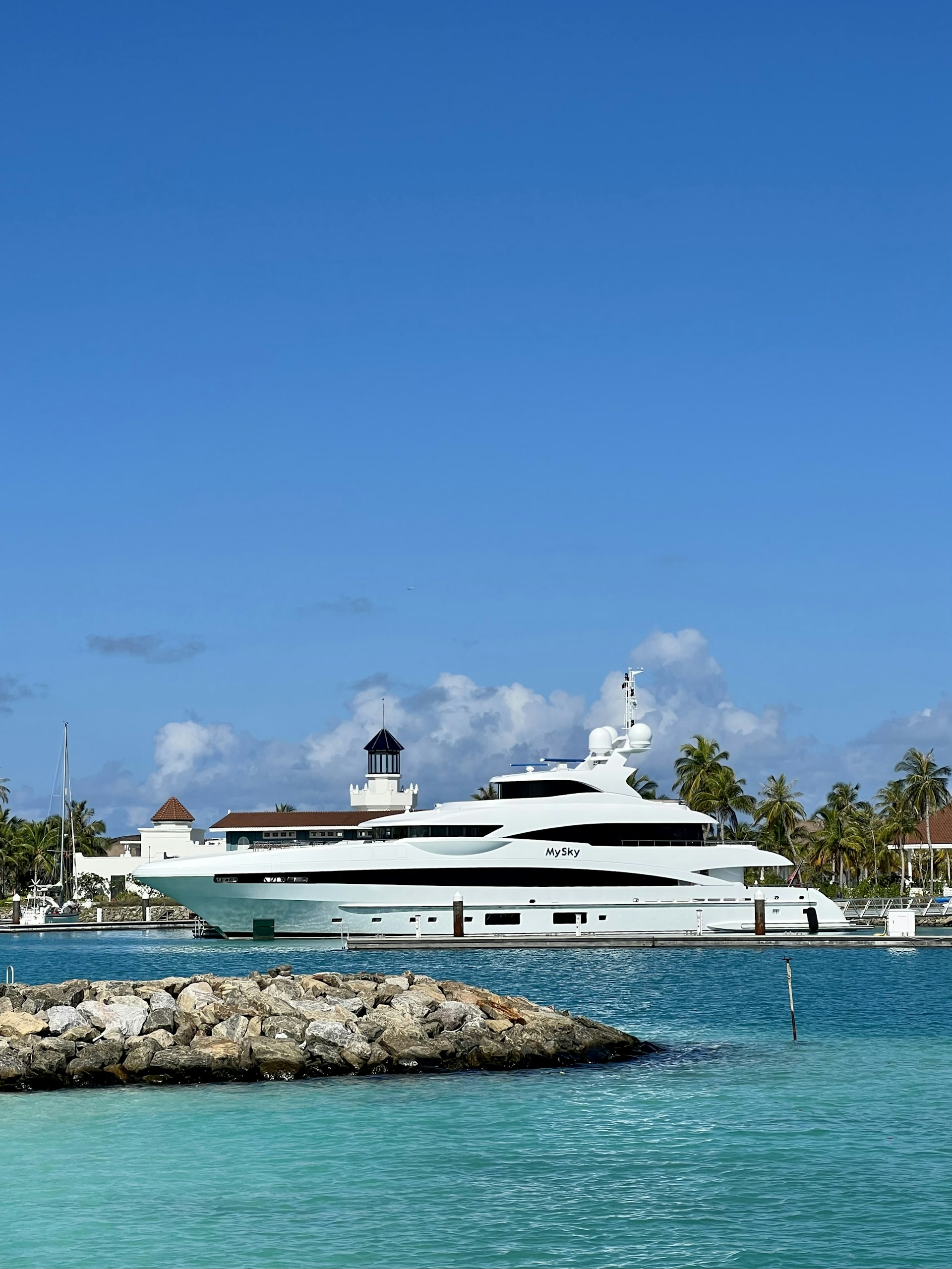 A private chef preparing fresh seafood dishes on a luxury yacht with turquoise Caribbean waters in the background.