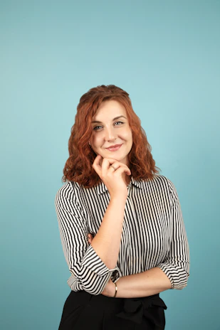 A smiling person thoughtfully reviewing a list of options, symbolizing confident decision-making.