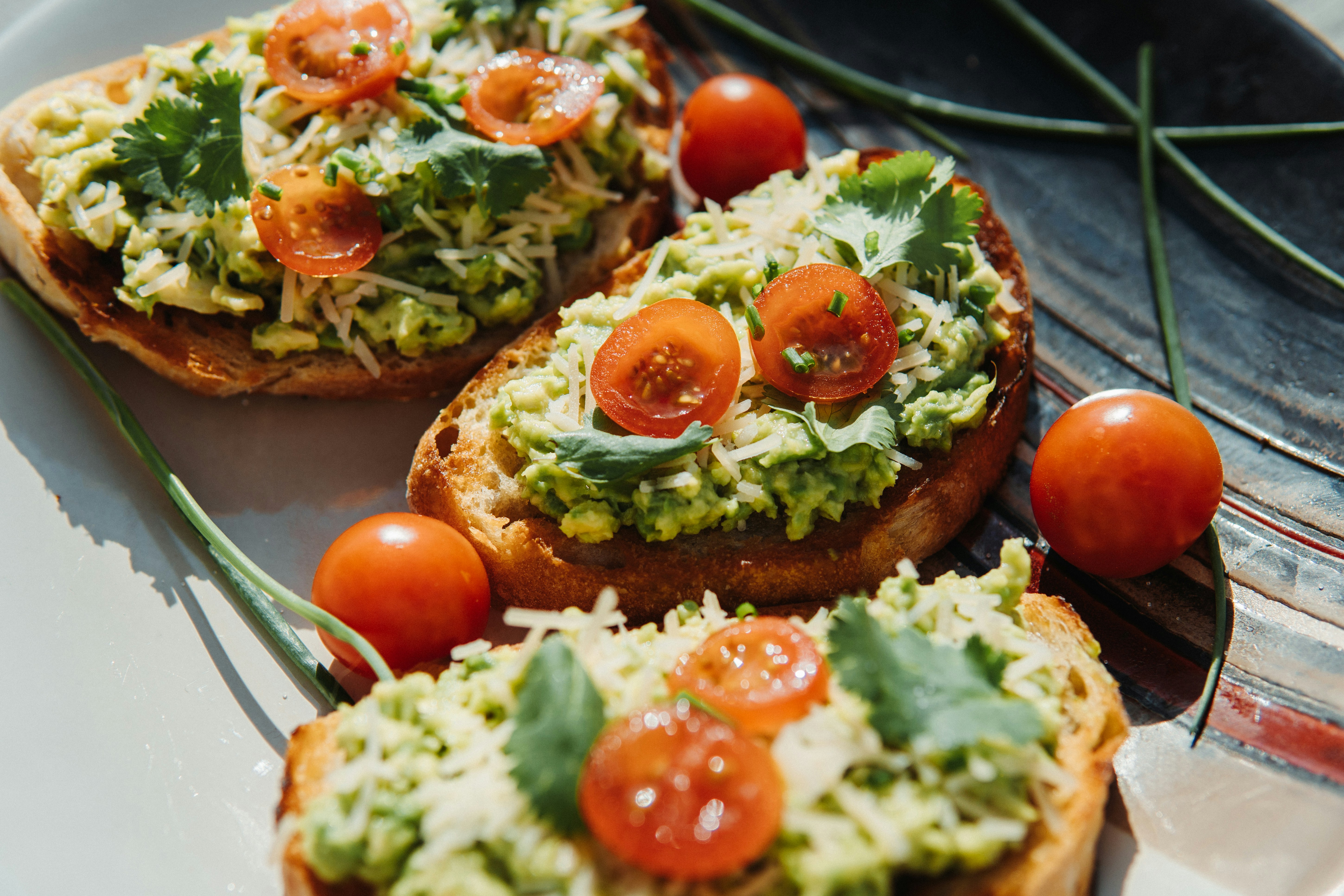 a white plate topped with bread topped with veggies