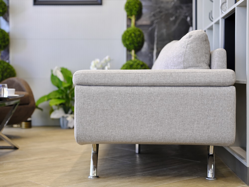 a couch sitting on top of a hard wood floor