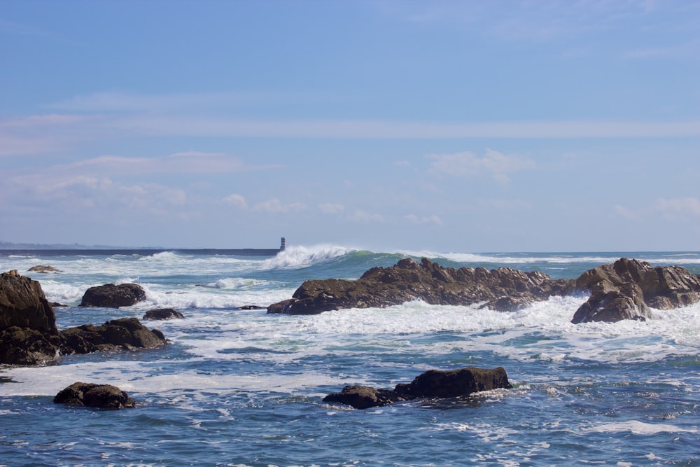 a person riding a surfboard on a wave in the ocean