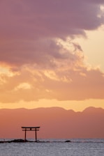 a large body of water under a cloudy sky