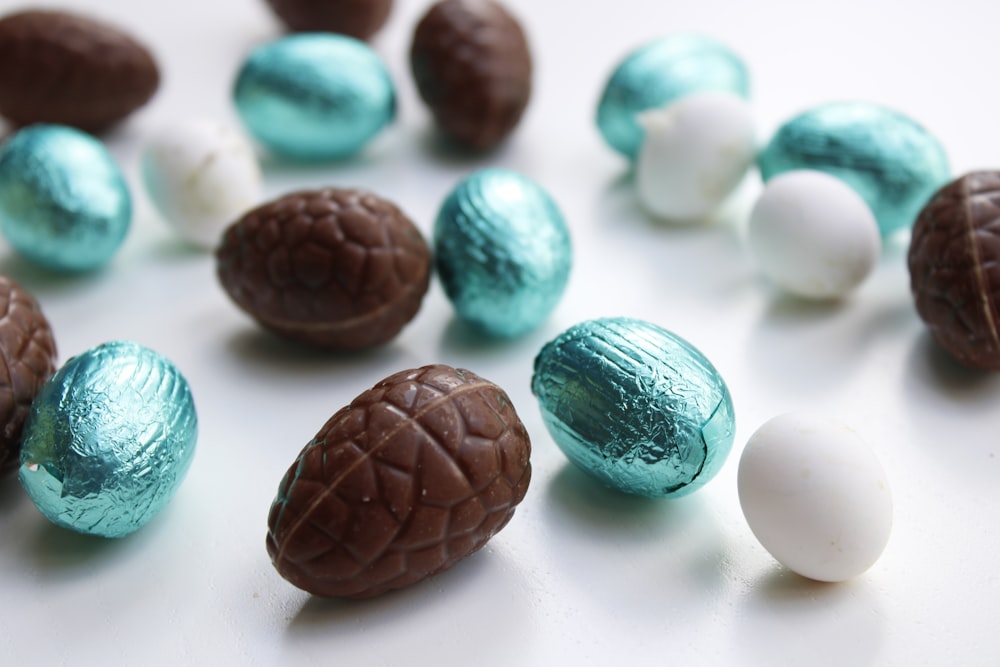 a white table topped with assorted chocolates and nuts