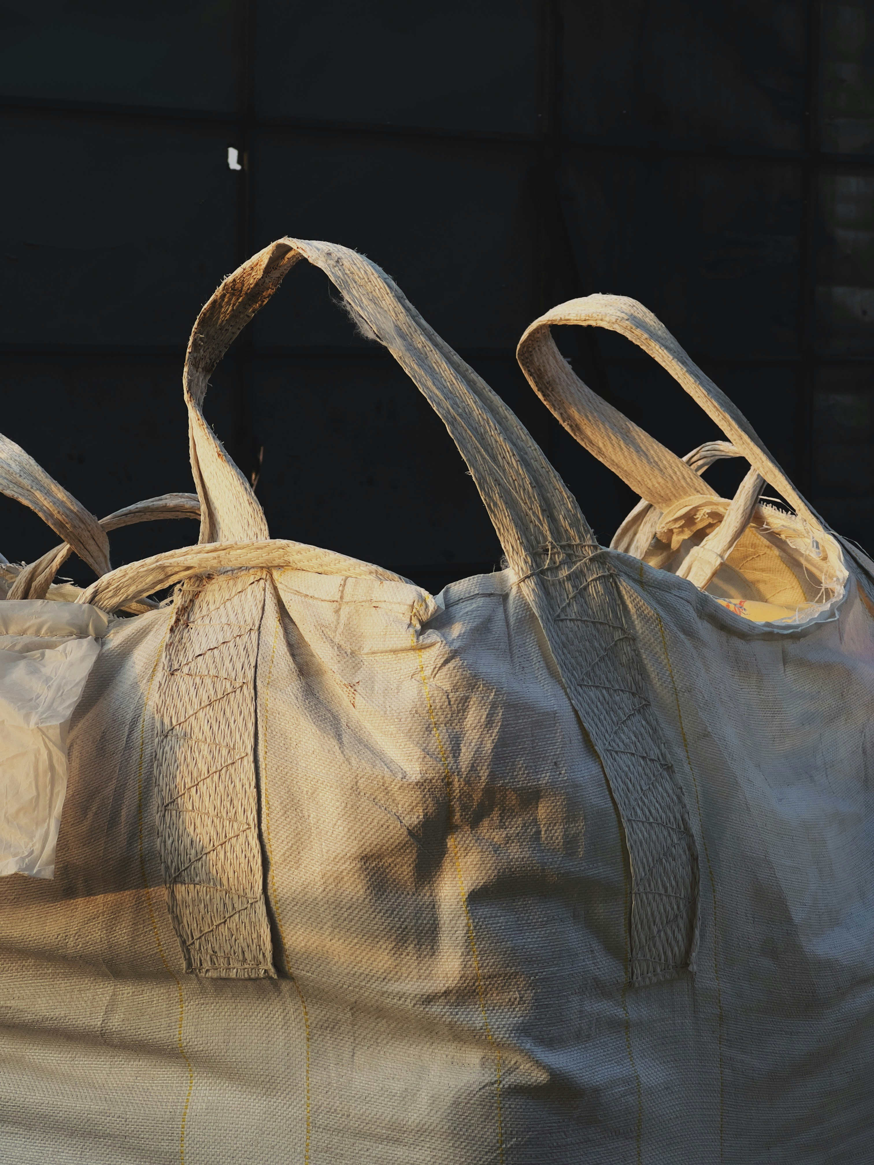 a large bag sitting on top of a pile of bags