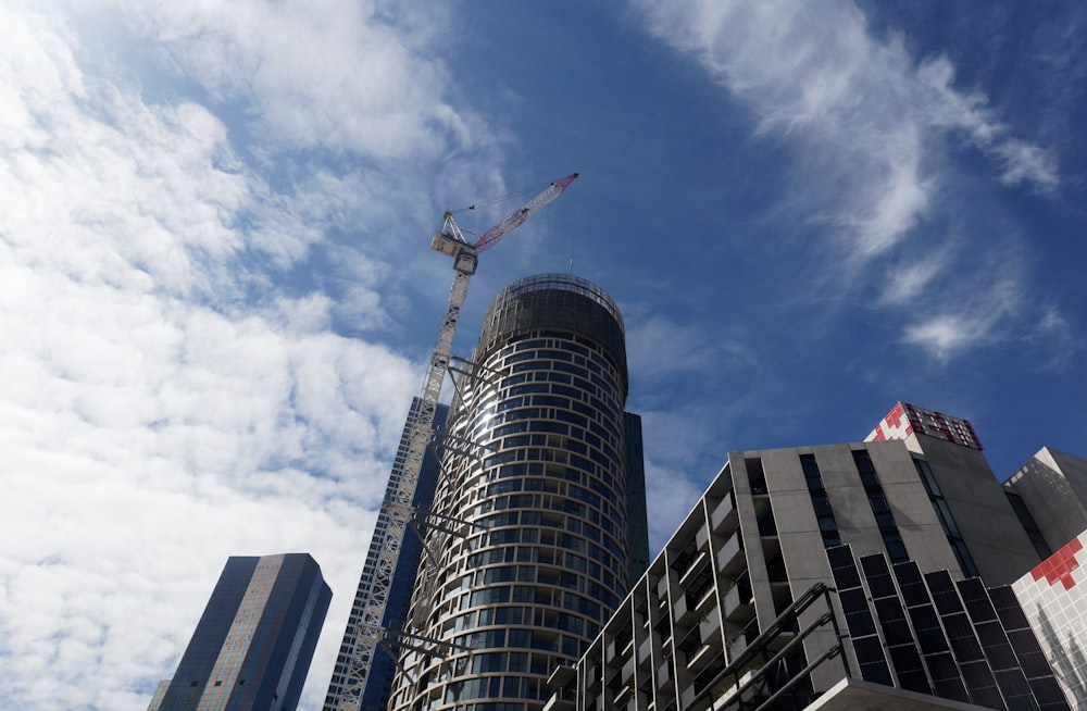 a very tall building with a crane on top of it