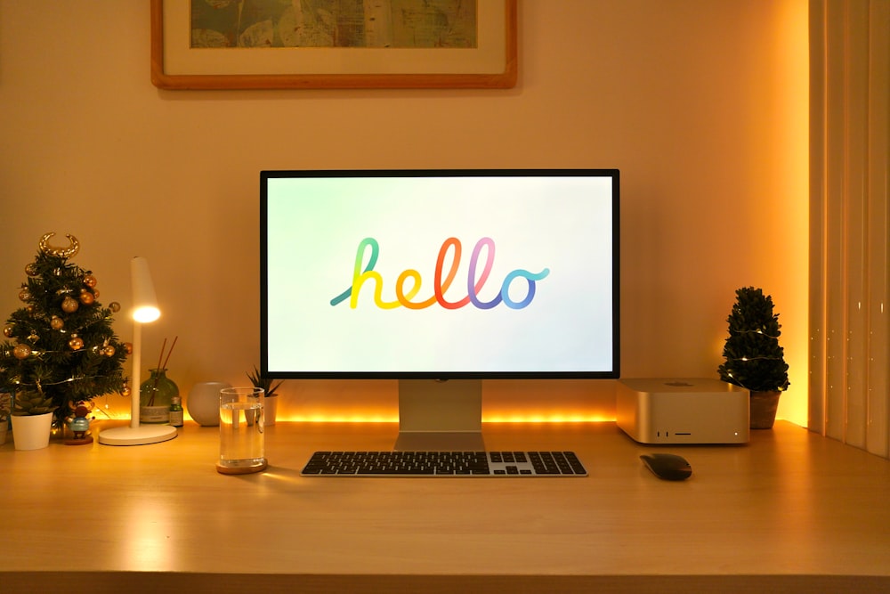 a desktop computer sitting on top of a wooden desk