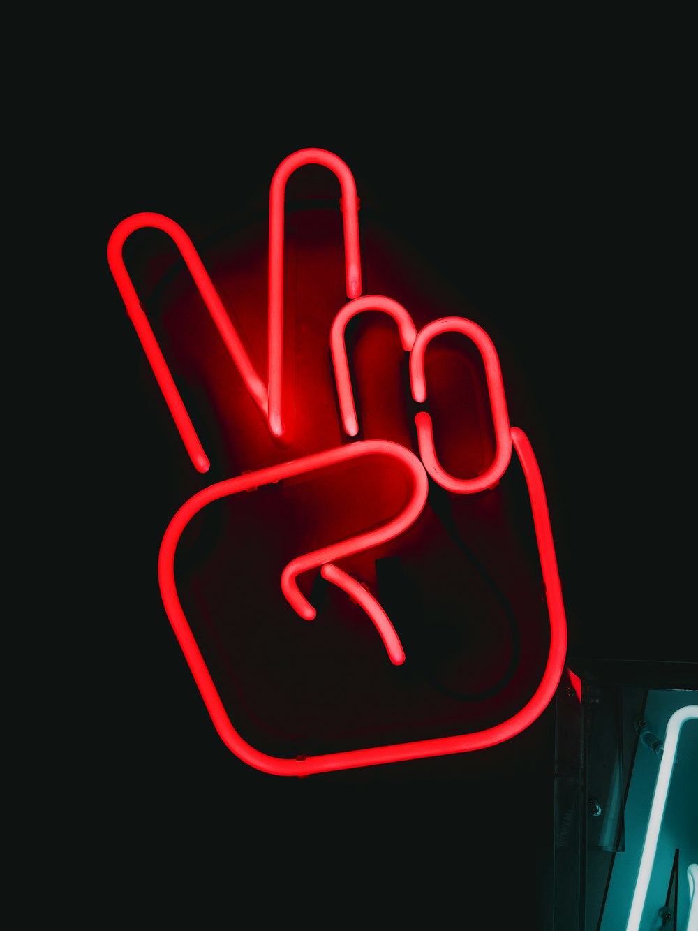 a neon sign with a peace sign in the middle of it