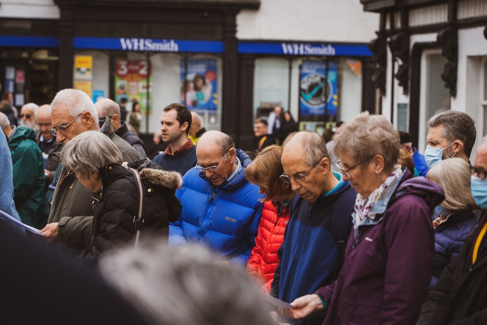 a group of people standing around each other