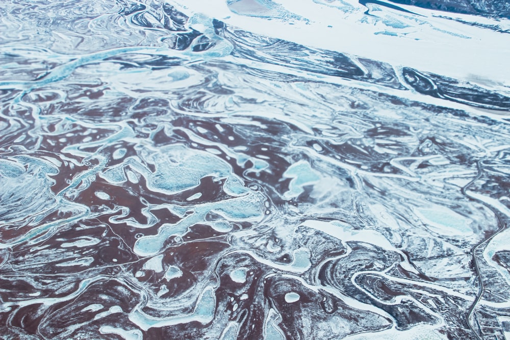 an aerial view of a snow covered landscape