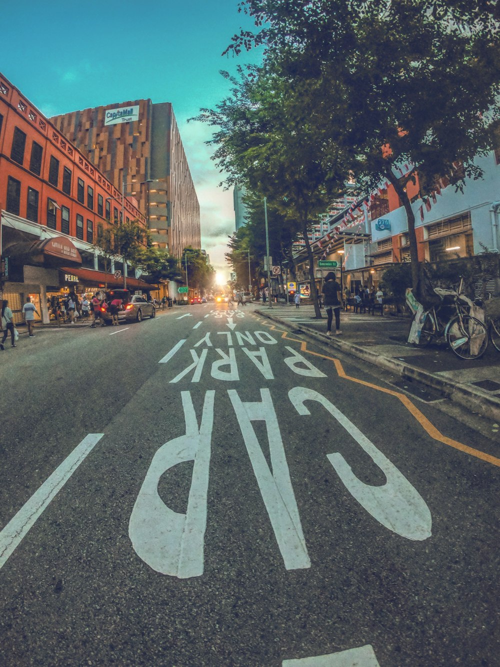 a city street with white painted lines on the road