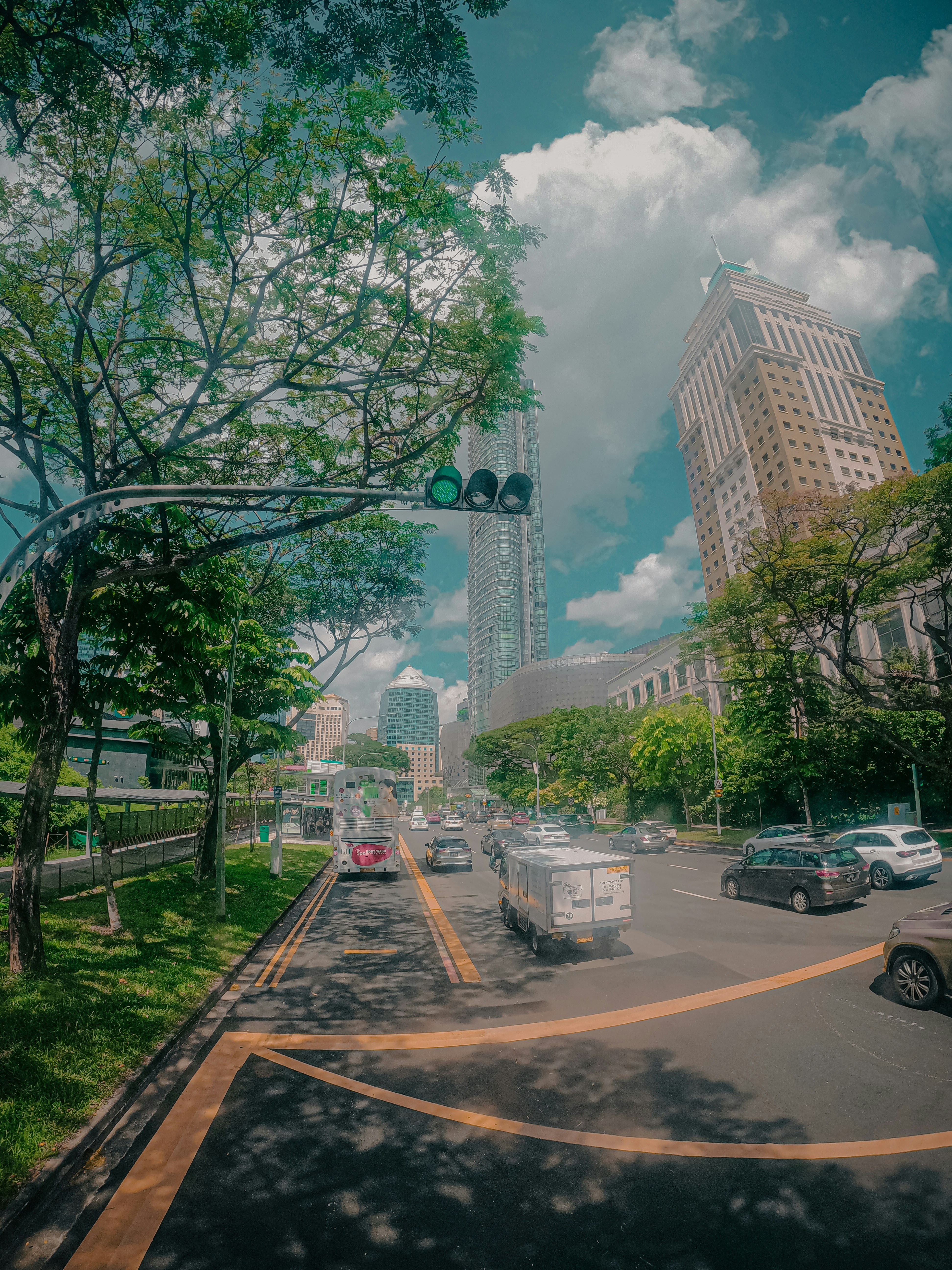 a city street with a traffic light on a cloudy day