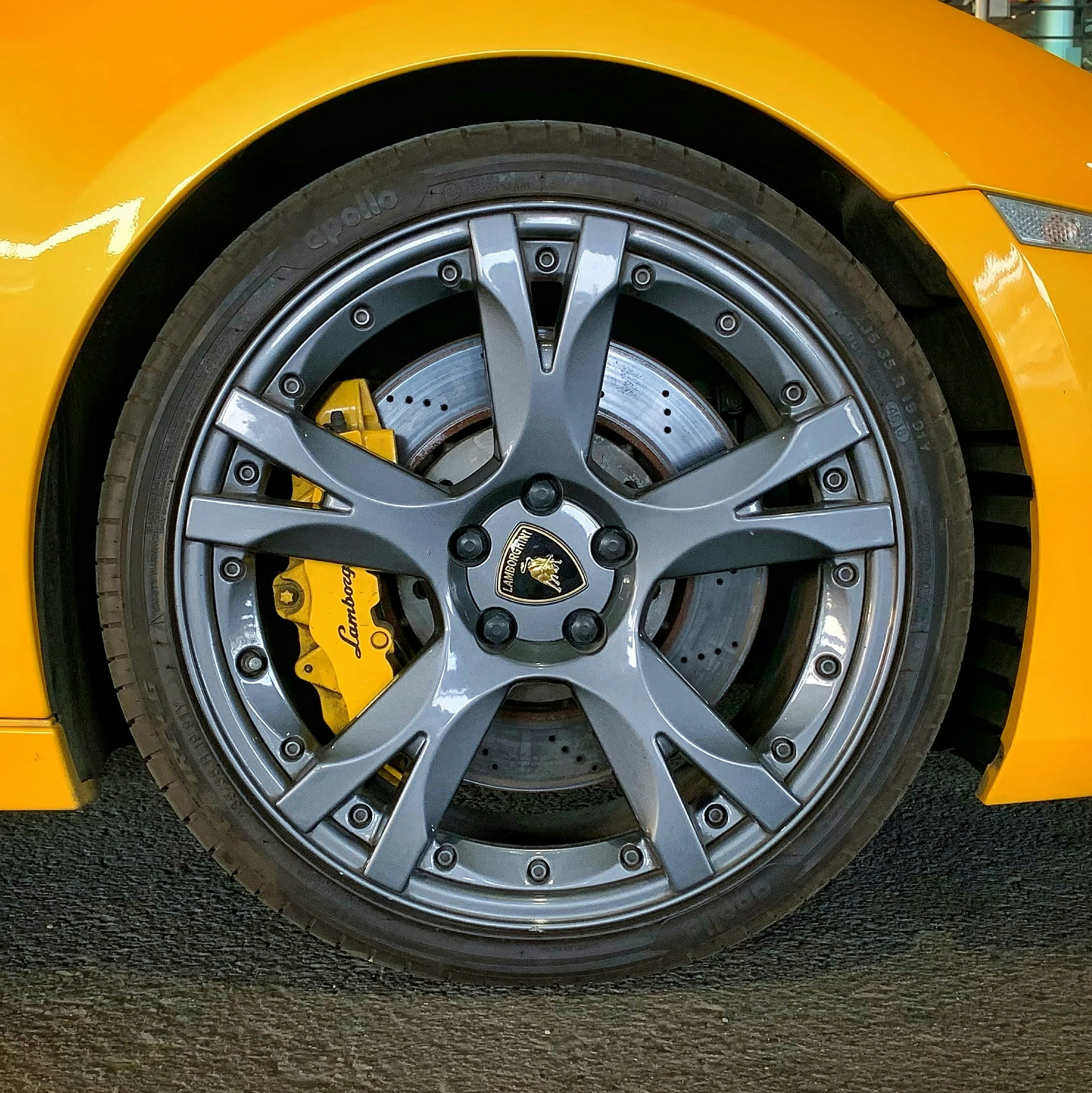A close up of a yellow sports car wheel photo – Free India Image on ...