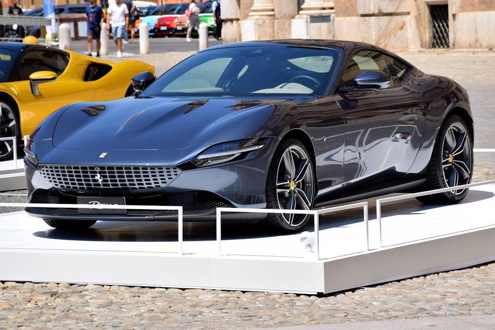 a black sports car on display at a car show