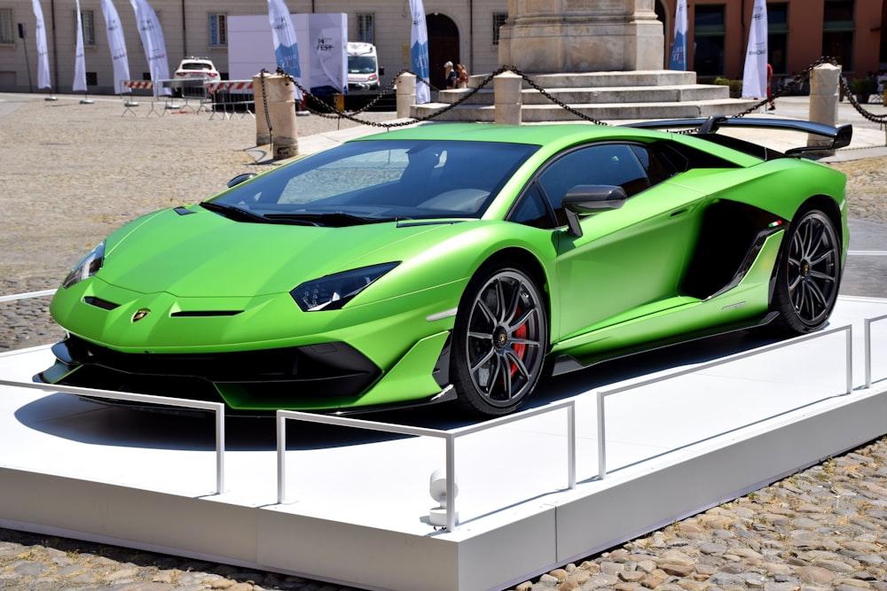 a bright green sports car is on display