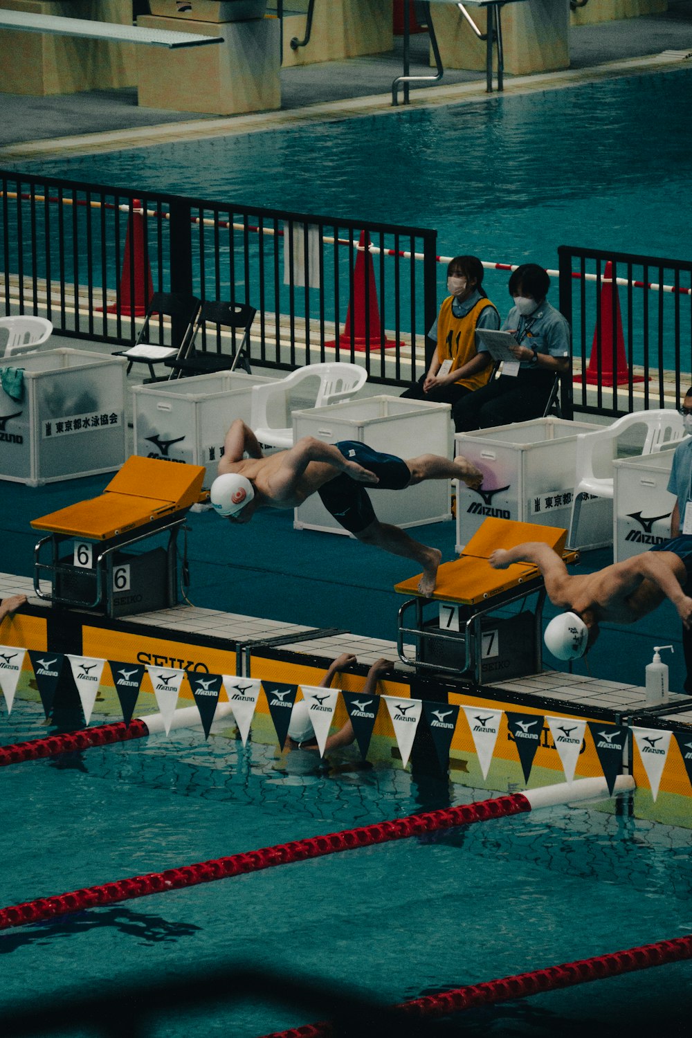 a group of people in a pool of water