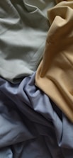 a close up of a bed with sheets and sheets